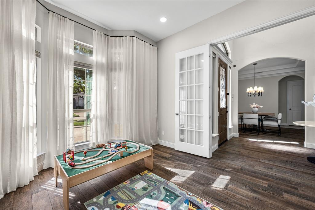 8 Center Court Heath, TX 75032 - Photo 10 of 34 a living room with furniture and a window