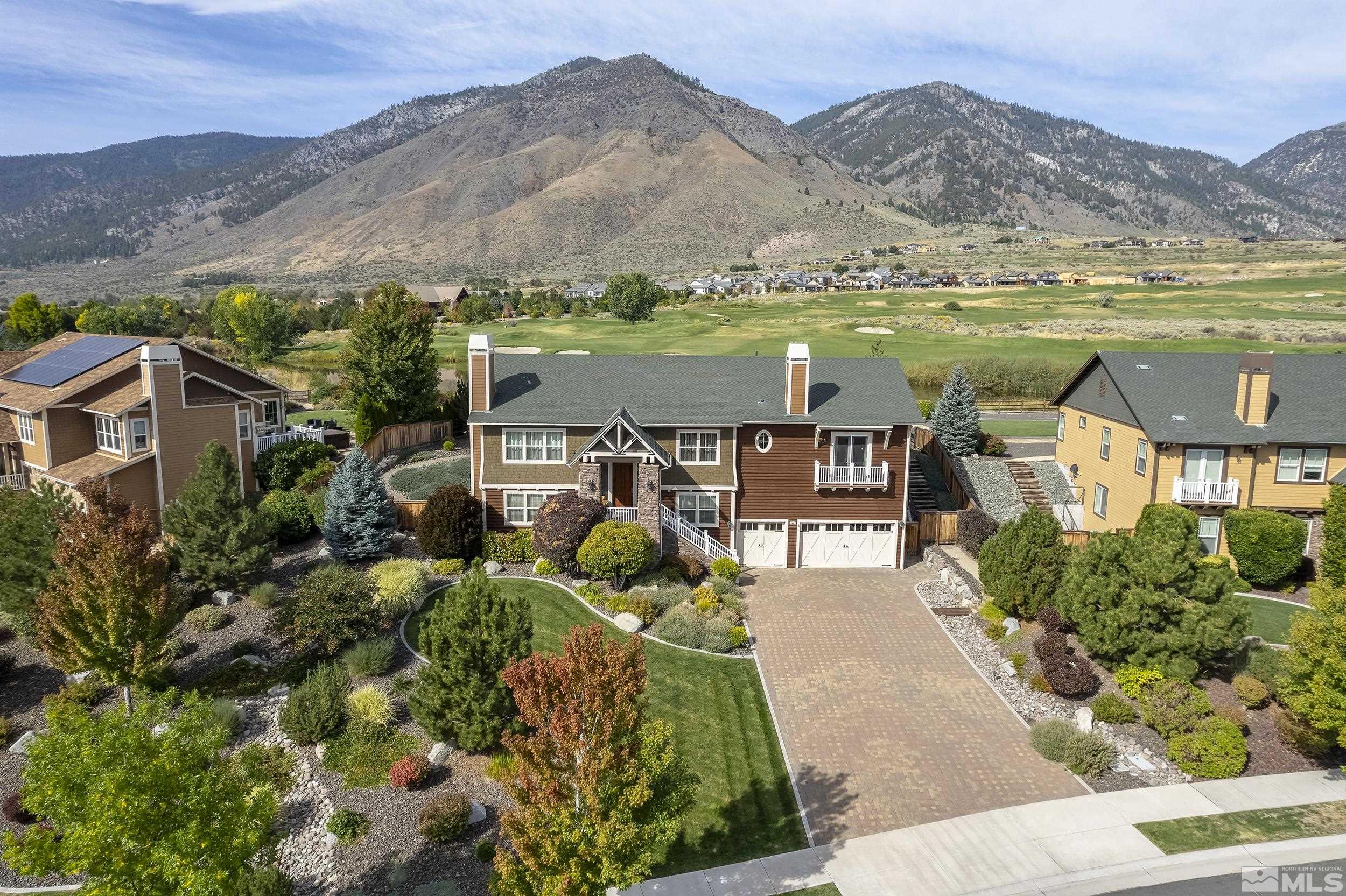 2892 Promontory Drive Genoa, NV 89411 - Photo 1 of 40 a view of a lake with a mountain in the background