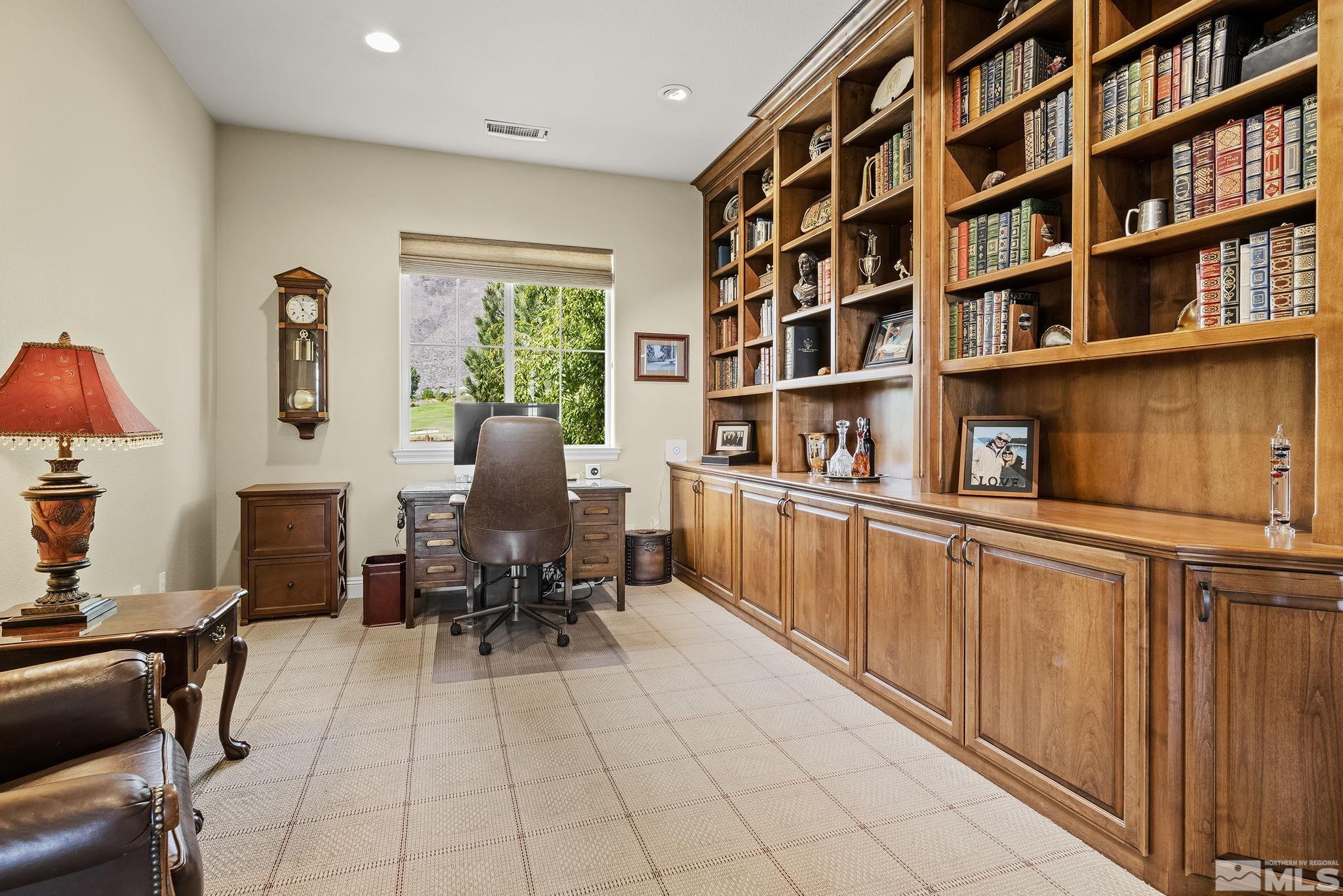 2892 Promontory Drive Genoa, NV 89411 - Photo 21 of 40 a dining room with furniture and a book shelf