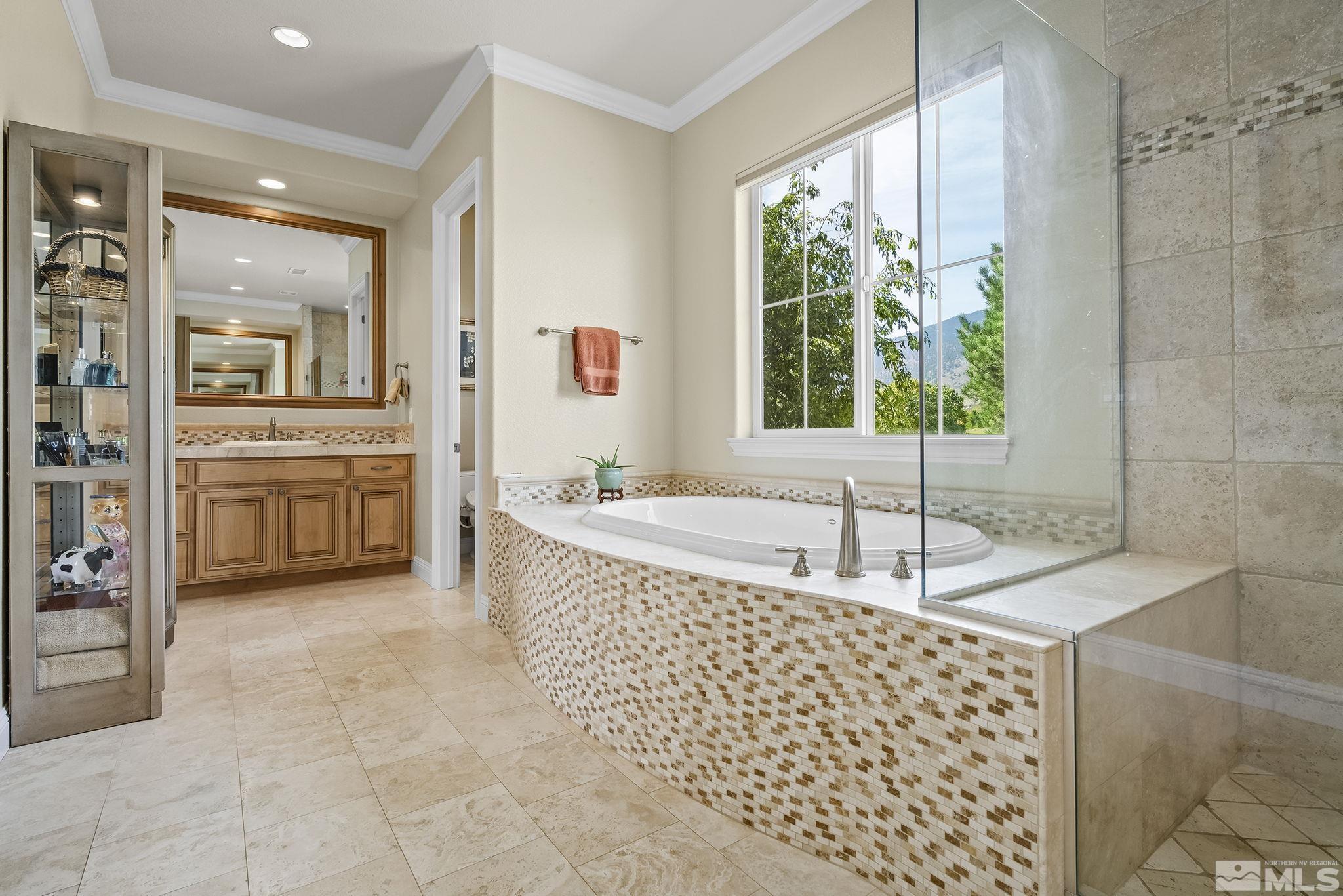 2892 Promontory Drive Genoa, NV 89411 - Photo 26 of 40 a large bathroom with a tub and window