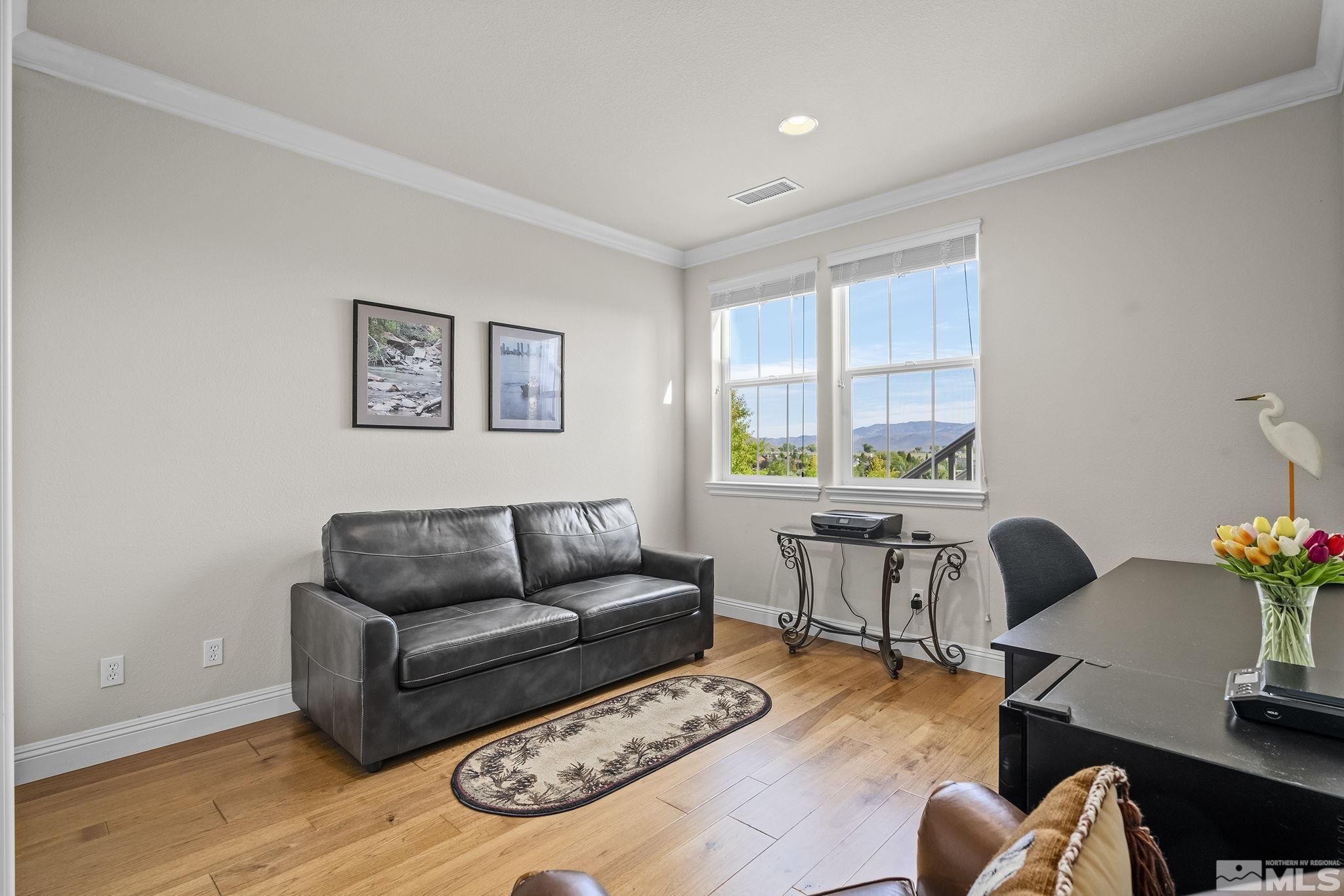 2892 Promontory Drive Genoa, NV 89411 - Photo 27 of 40 a living room with furniture and wooden floor