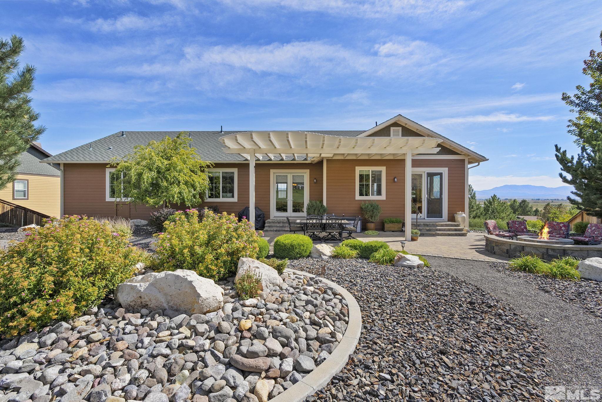 2892 Promontory Drive Genoa, NV 89411 - Photo 31 of 40 a front view of a house with garden