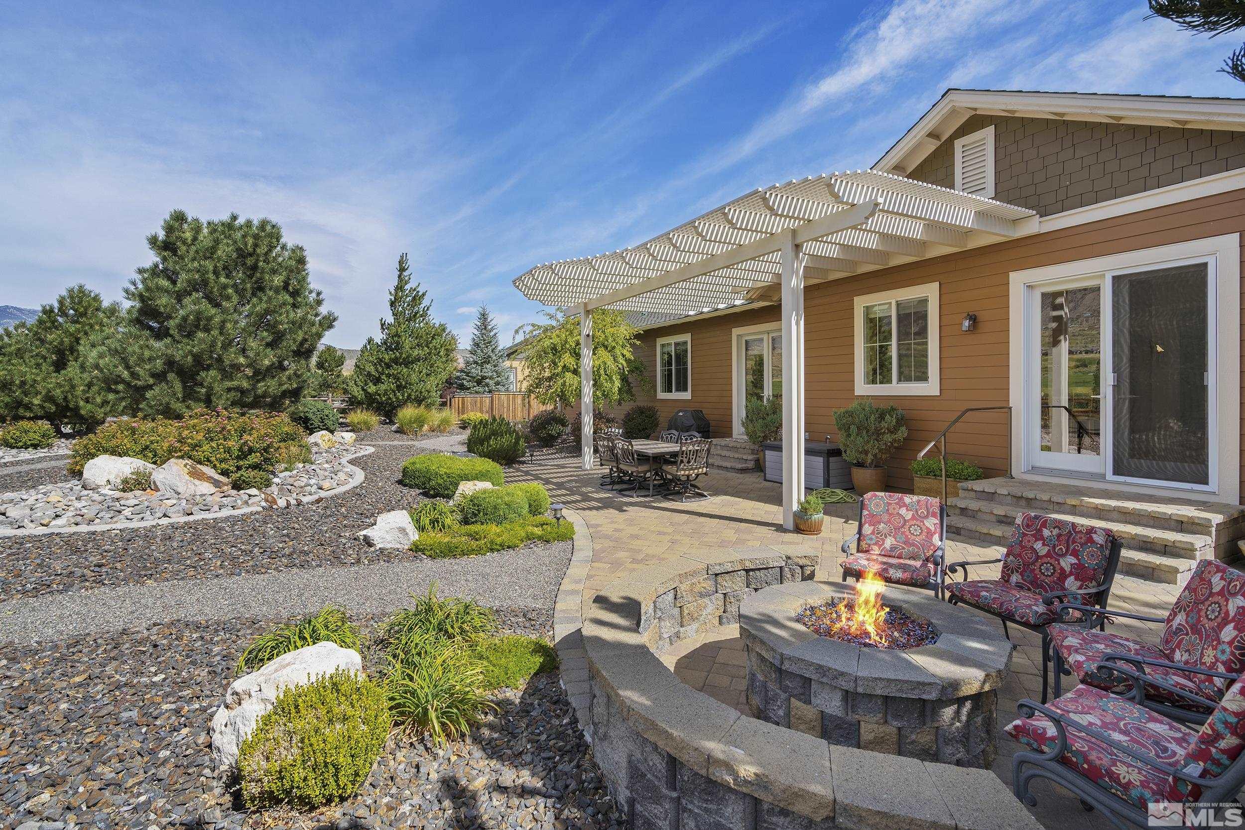 2892 Promontory Drive Genoa, NV 89411 - Photo 35 of 40 a view of a patio with couches table and chairs and potted plants