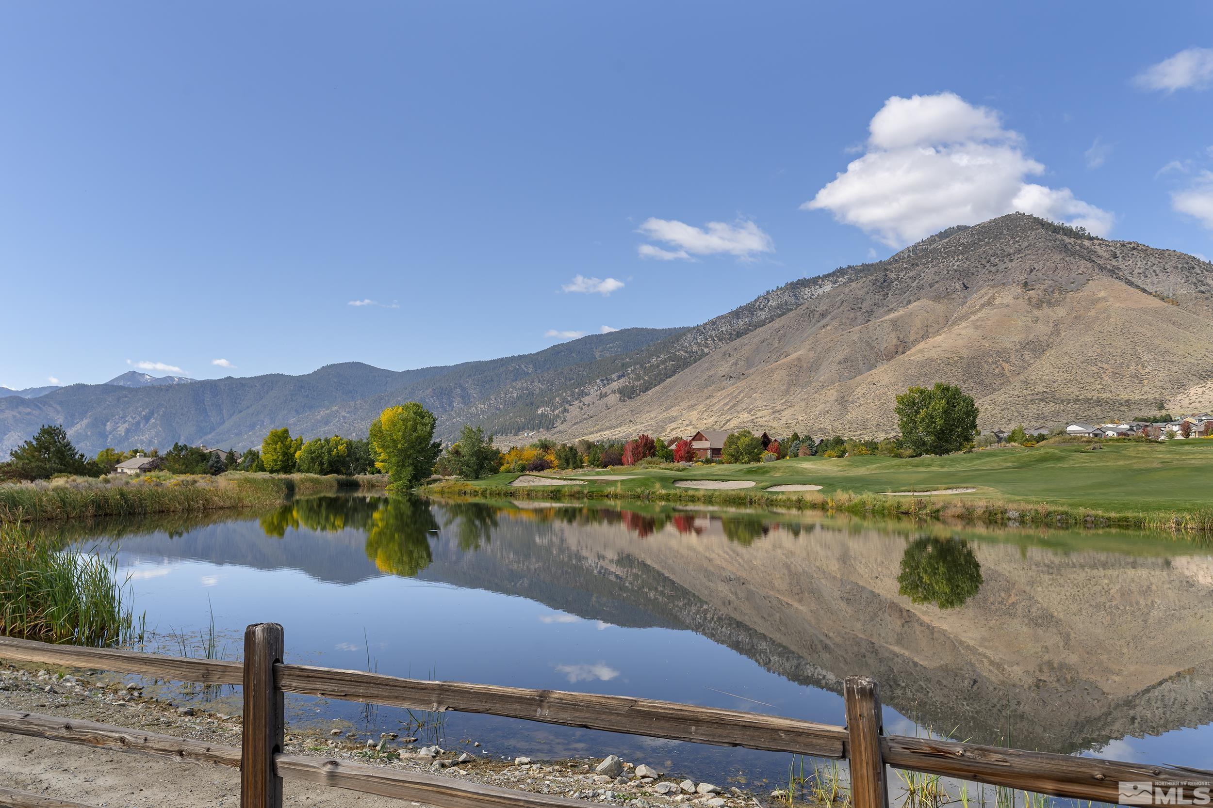 2892 Promontory Drive Genoa, NV 89411 - Photo 37 of 40 a view of a lake with a mountain in the background
