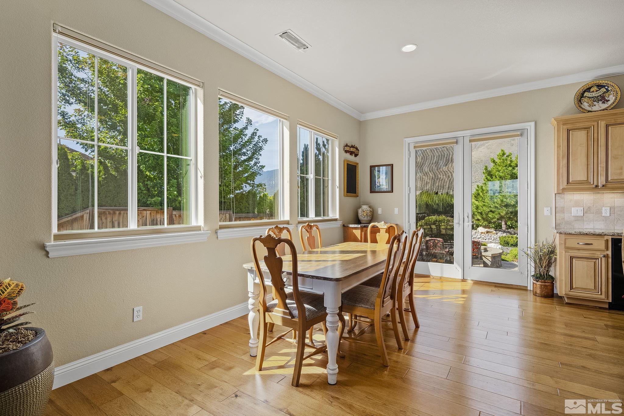 2892 Promontory Drive Genoa, NV 89411 - Photo 9 of 40 a dining room with furniture window and wooden floor