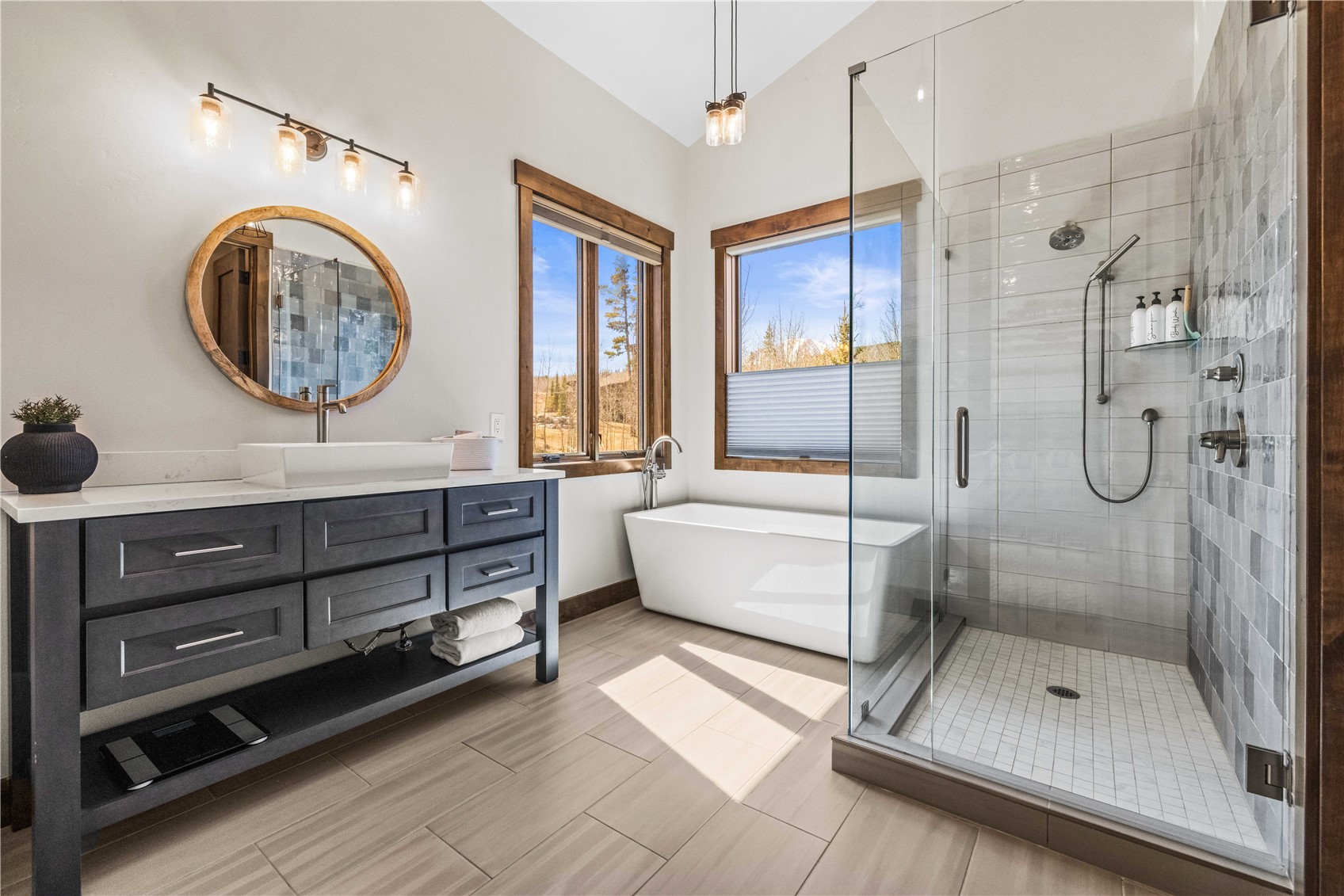 230 Game Trail Road Silverthorne, CO 80498 - Photo 36 of 43 a bathroom with a tub shower and mirror