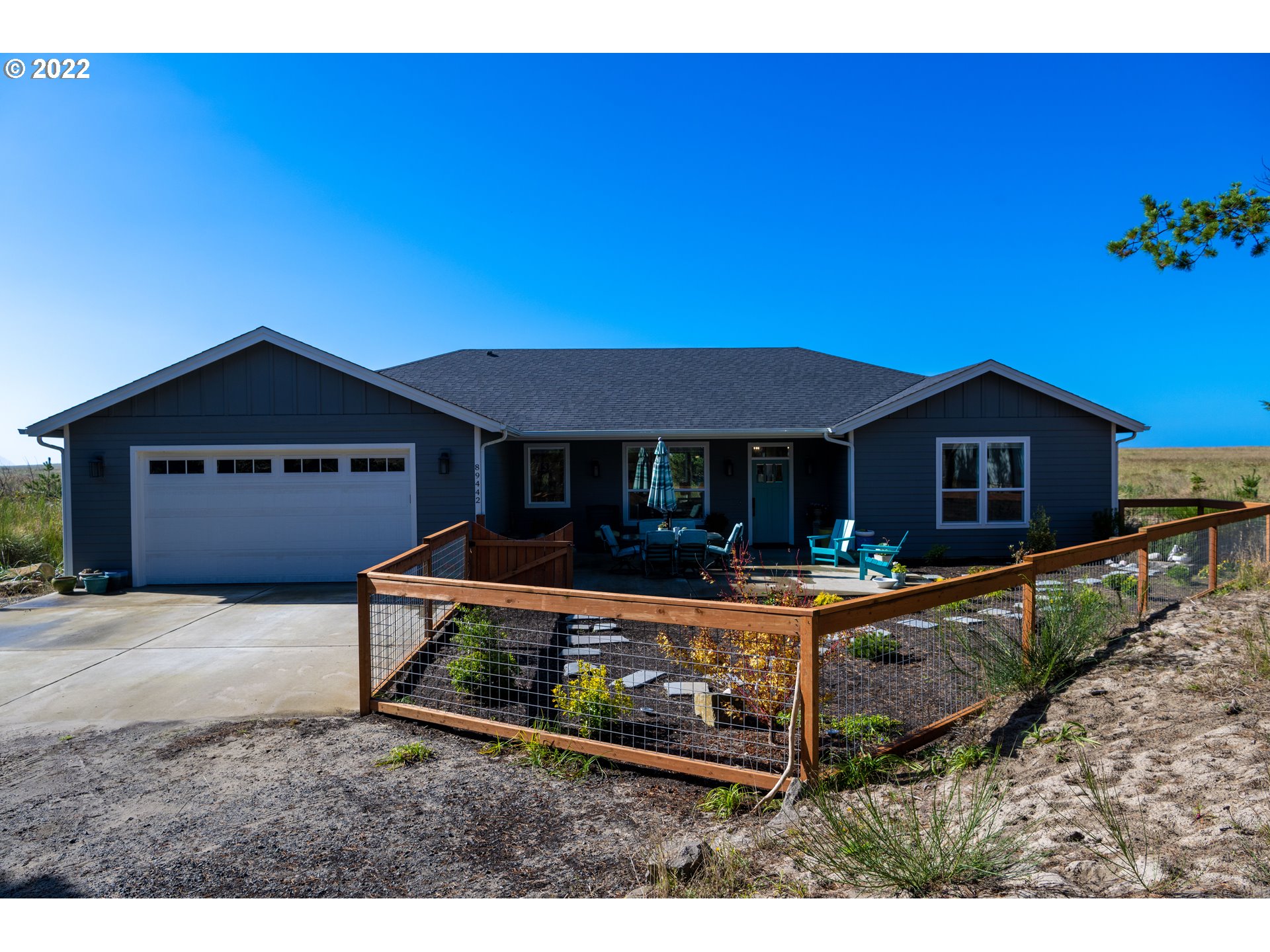 a front view of a house with yard and porch