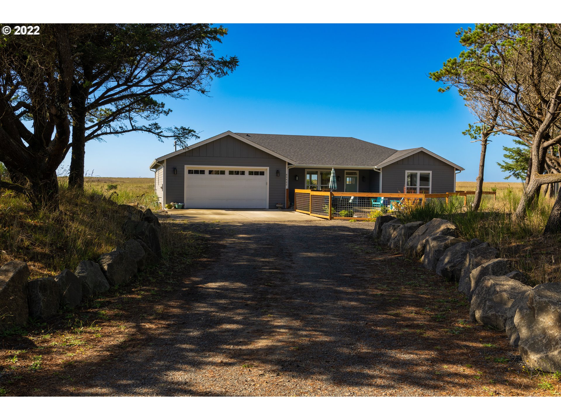 89442 Ocean Drive Warrenton, OR 97146 - Photo 15 of 31 a front view of a house with a yard