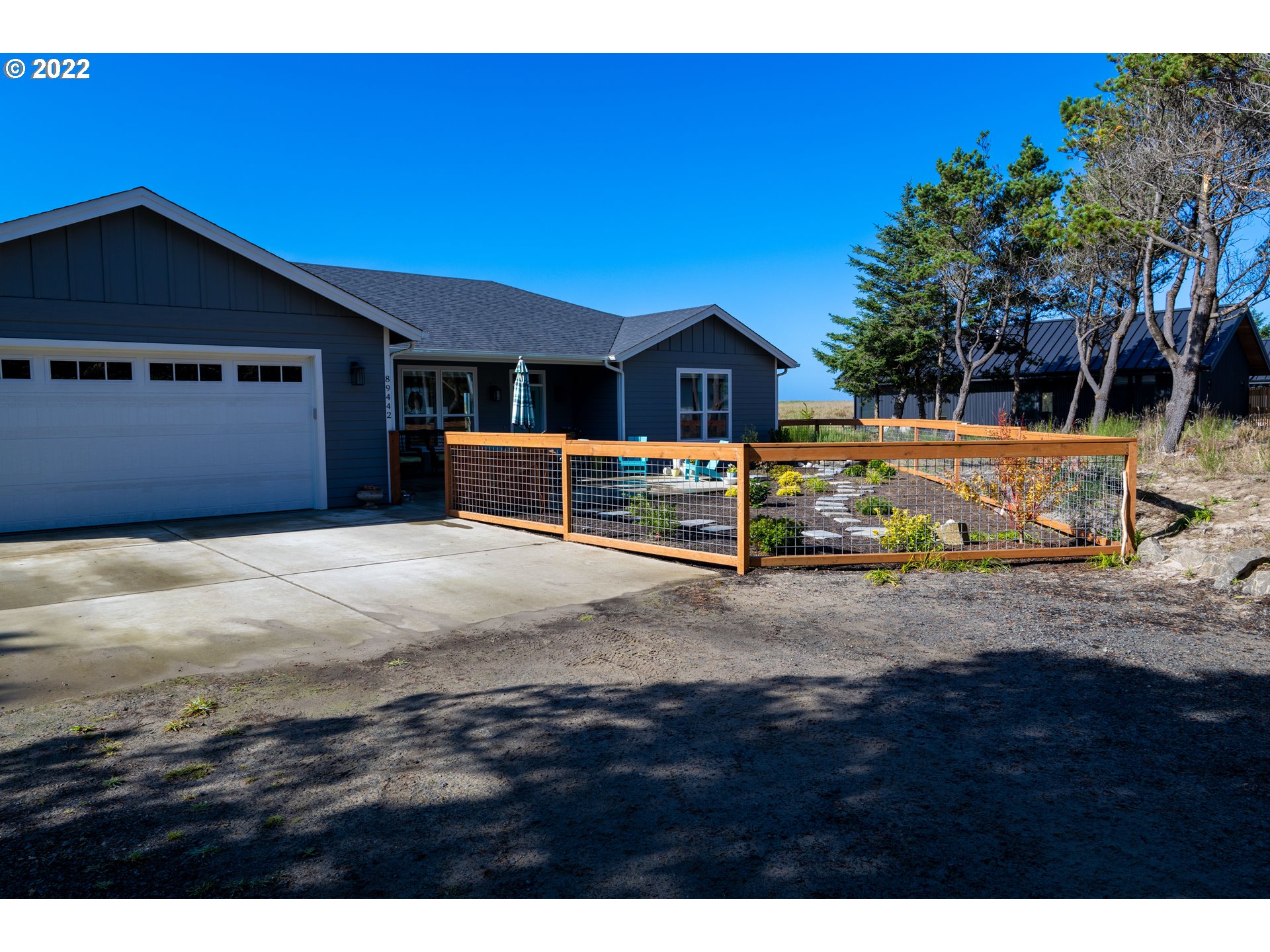 89442 Ocean Drive Warrenton, OR 97146 - Photo 17 of 31 a view of a house with a yard