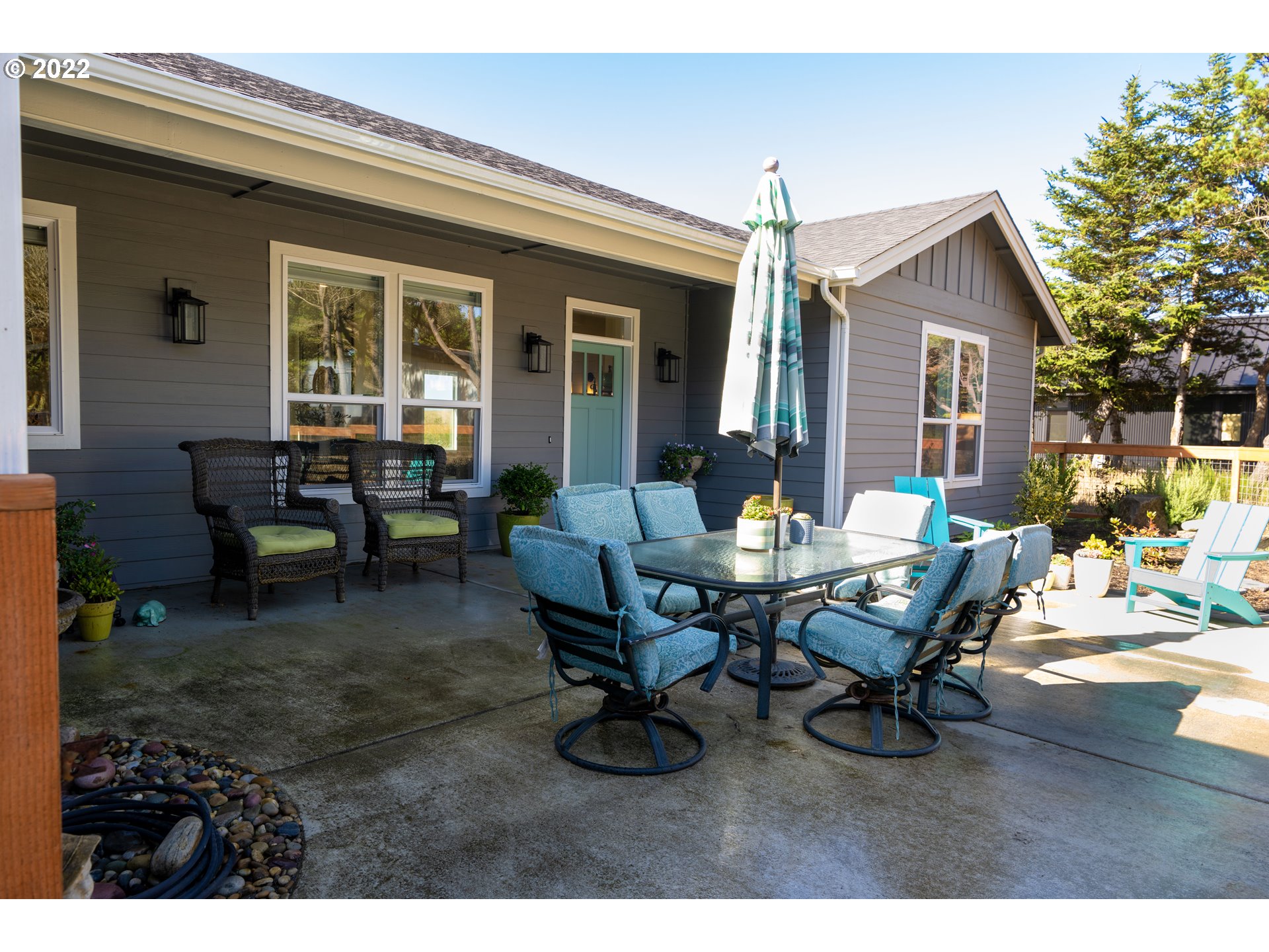 89442 Ocean Drive Warrenton, OR 97146 - Photo 2 of 31 a view of a house with patio and a yard