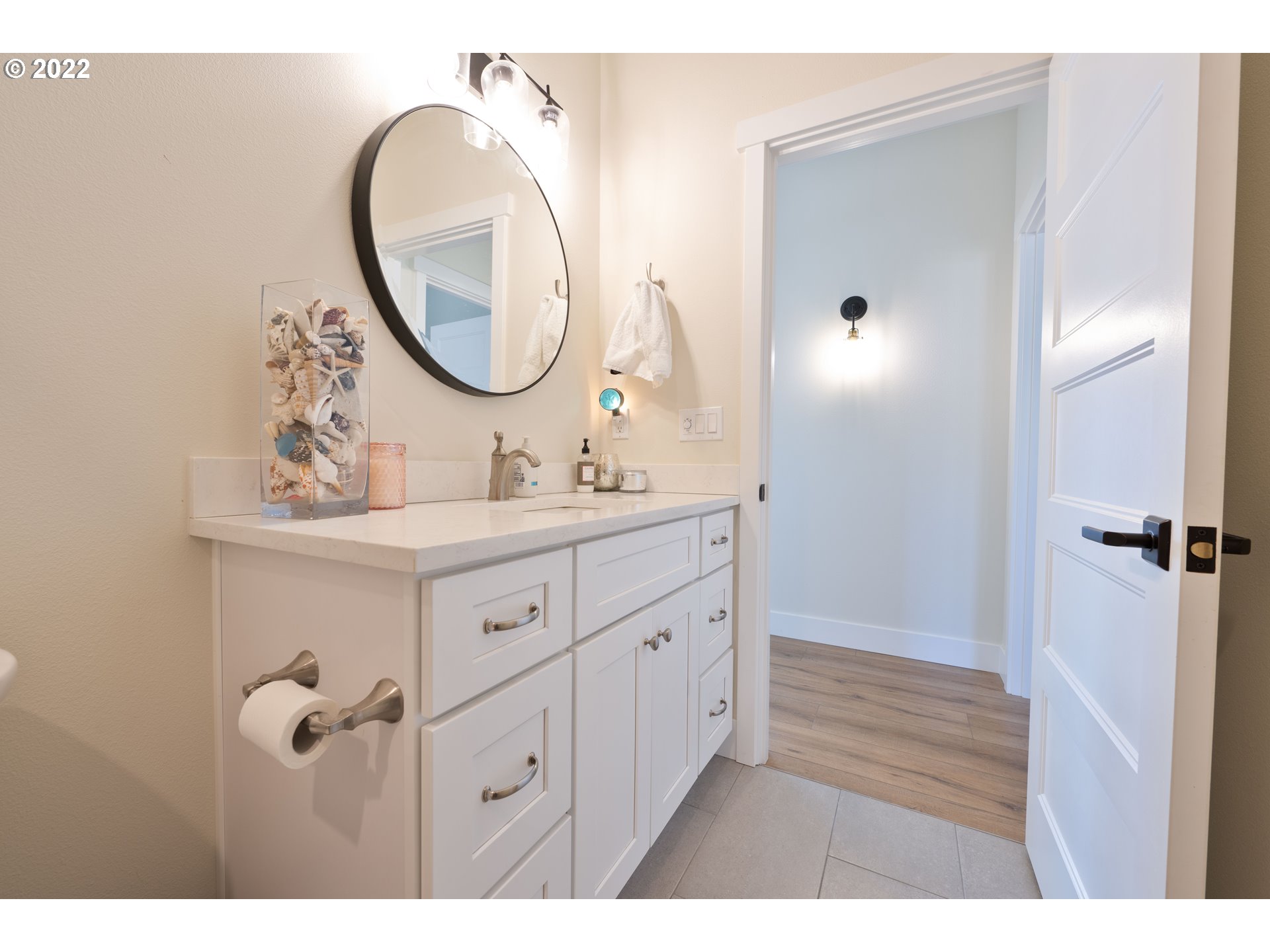 89442 Ocean Drive Warrenton, OR 97146 - Photo 9 of 31 a bathroom with a sink and a mirror