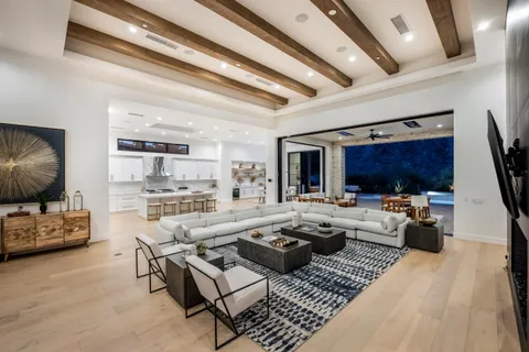 a living room with fireplace furniture and a flat screen tv