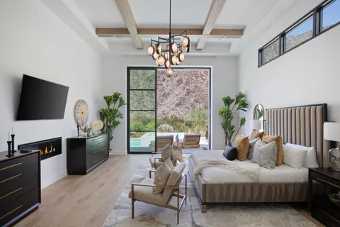 a bathroom with a glass shower and windows