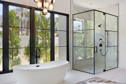 a living room with furniture a chandelier and a chandelier