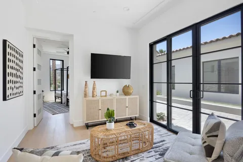 a bed room with a bed and a potted plant