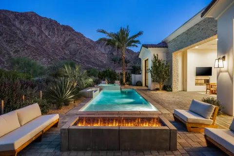 a view of outdoor sitting area with furniture