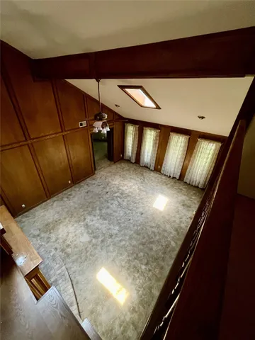a view of staircase and living room