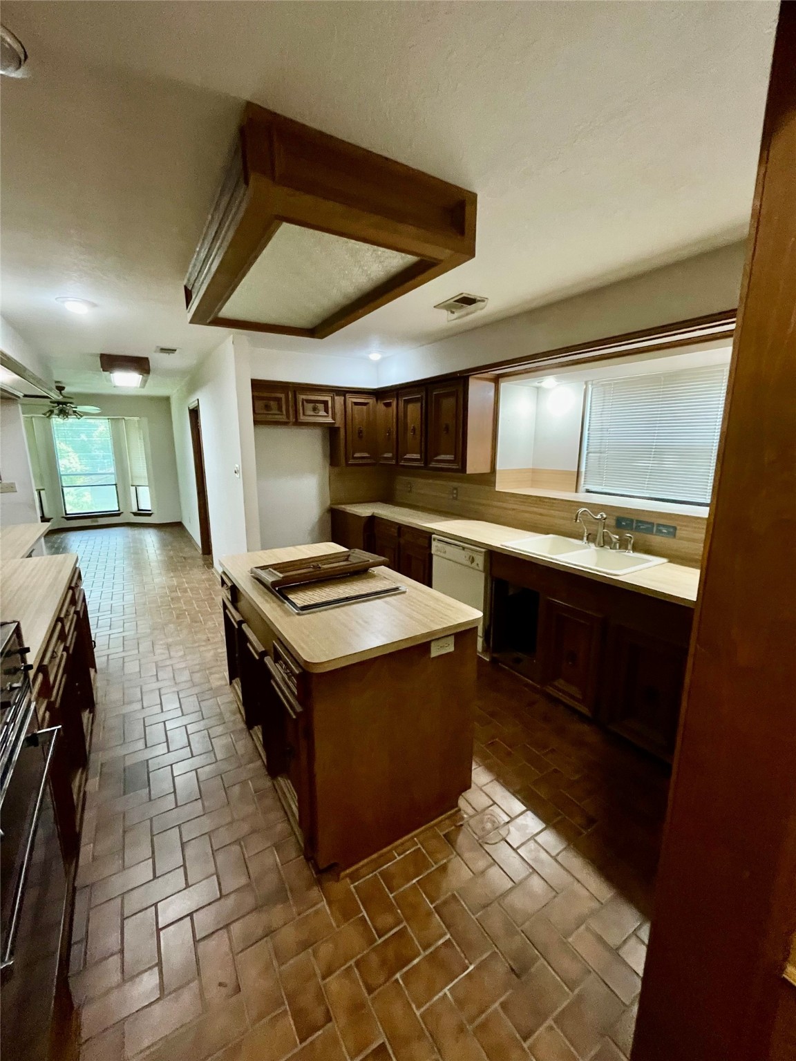 10074 Overbrook Drive Conroe, TX 77304 - Photo 6 of 22 a kitchen with stainless steel appliances granite countertop a stove and a sink