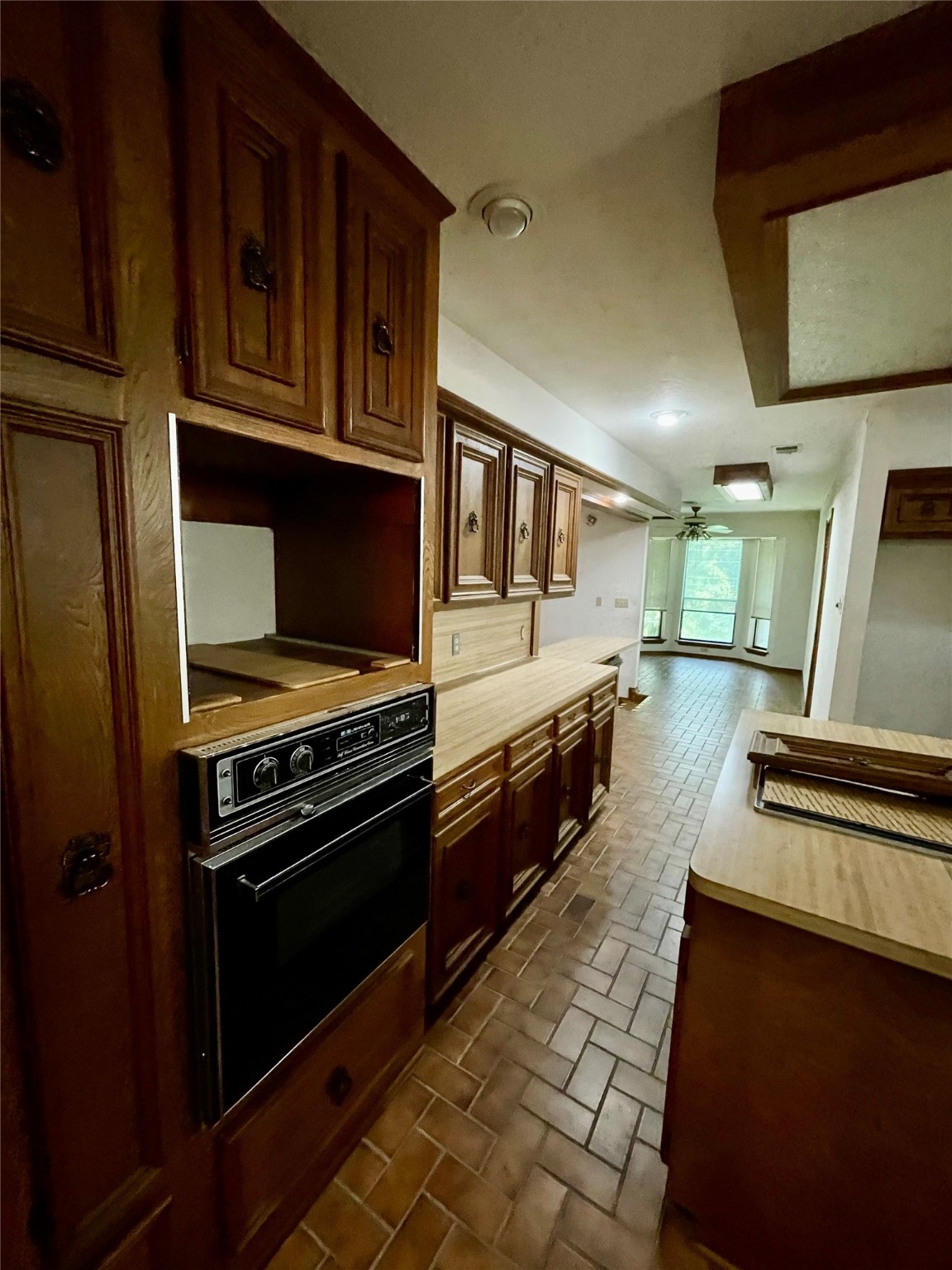 10074 Overbrook Drive Conroe, TX 77304 - Photo 7 of 22 a kitchen with stainless steel appliances granite countertop a stove and a microwave