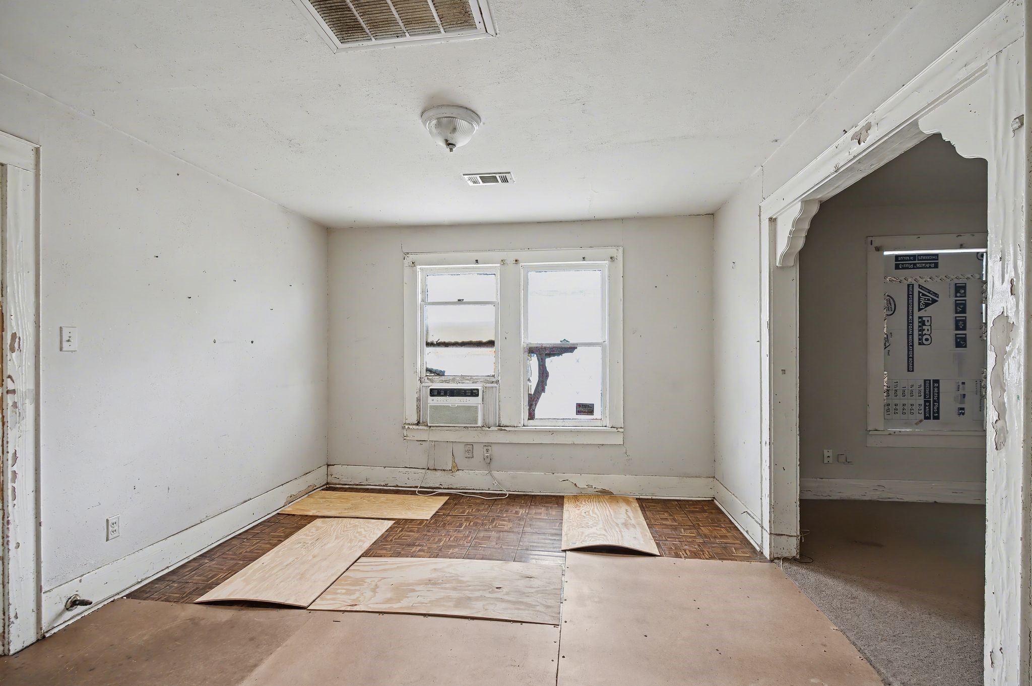 1218 Genova Street Houston, TX 77009 - Photo 11 of 15 A formal dining room between the living room and kitchen. This space could be used to extend the kitchen.
