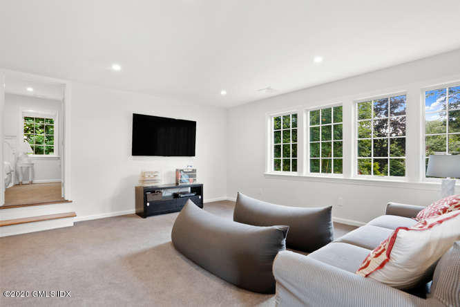 16 Pierce Road Riverside, CT 06878 - Photo 21 of 36 a living room with furniture and a flat screen tv