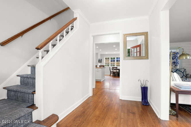 16 Pierce Road Riverside, CT 06878 - Photo 3 of 36 a view of a hallway with wooden floor and staircase
