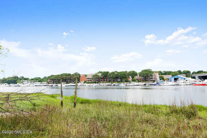 16 Pierce Road Riverside, CT 06878 - Photo 31 of 36 a view of a lake with houses in the back