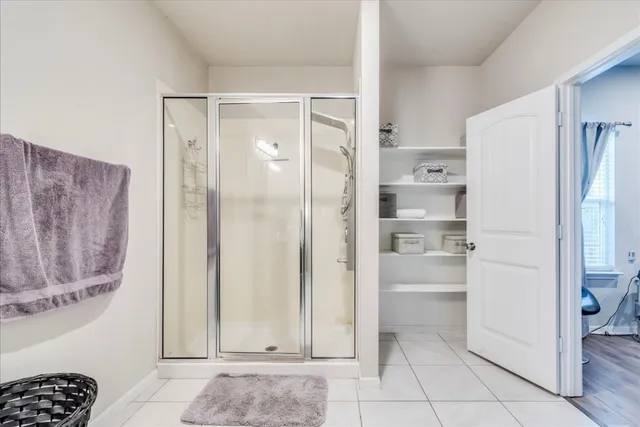 a view of a kitchen with a refrigerator and cabinets