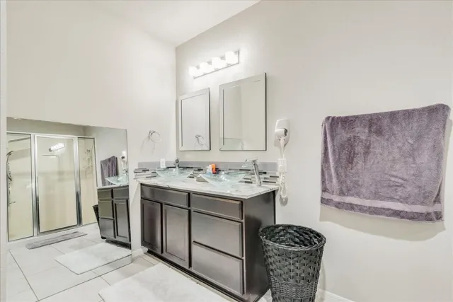 a bathroom with a sink a vanity and a mirror