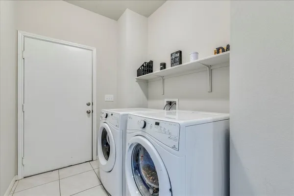 a utility room with dryer and washer