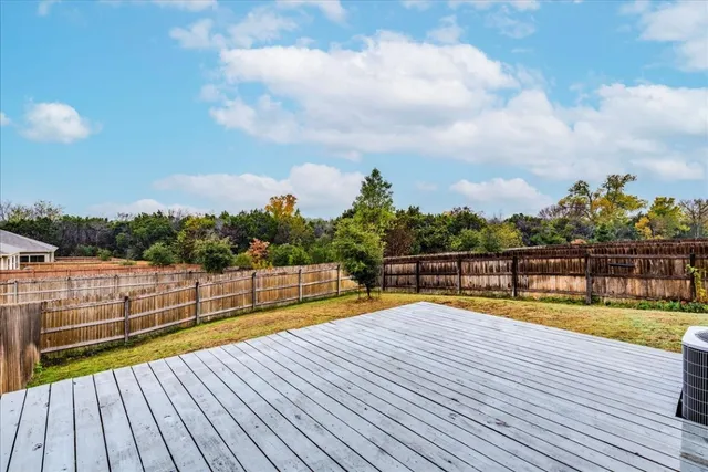 a view of a swimming pool with seating space