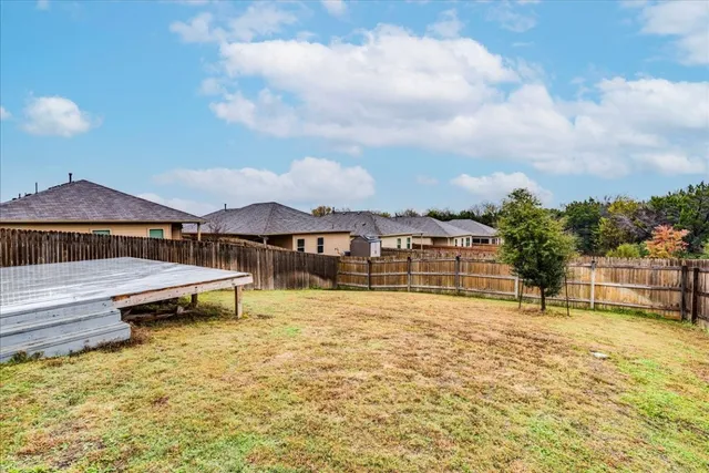 a view of a house with swimming pool and sitting area