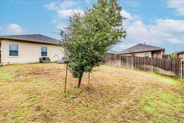 a house with yard in front of it