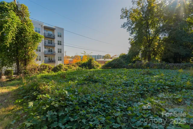 an aerial view of a house with a ocean view