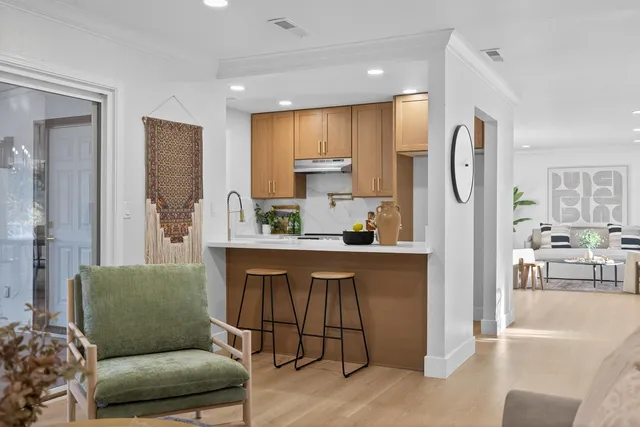 a view of a kitchen and dining room