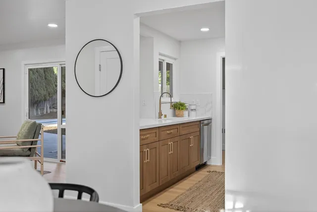 a kitchen with a sink appliances and cabinets