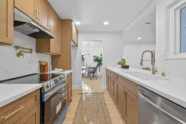 a kitchen with a stove and cabinets