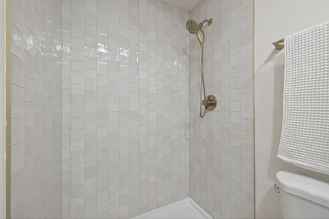 a bathroom with a sink a mirror and a toilet