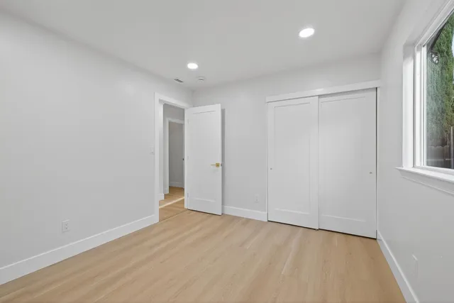 a view of a patio with a table chairs and a porch