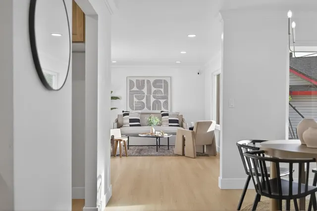a view of a dining room with furniture window and wooden floor