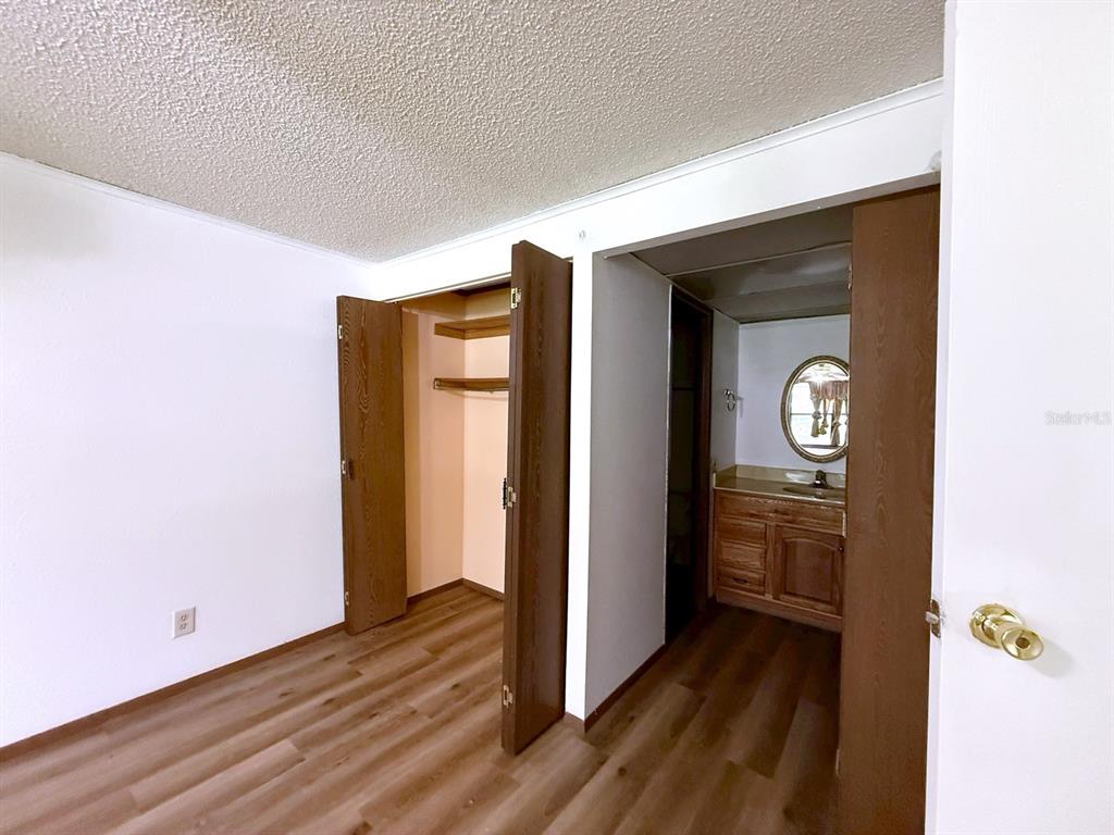 33248 Ridge Manor Boulevard Dade City, FL 33523 - Photo 12 of 20 a view of hallway with wooden floor