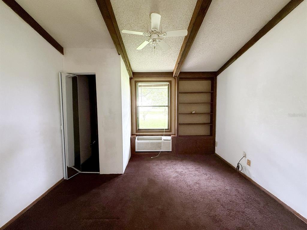 33248 Ridge Manor Boulevard Dade City, FL 33523 - Photo 14 of 20 an empty room with windows and closet