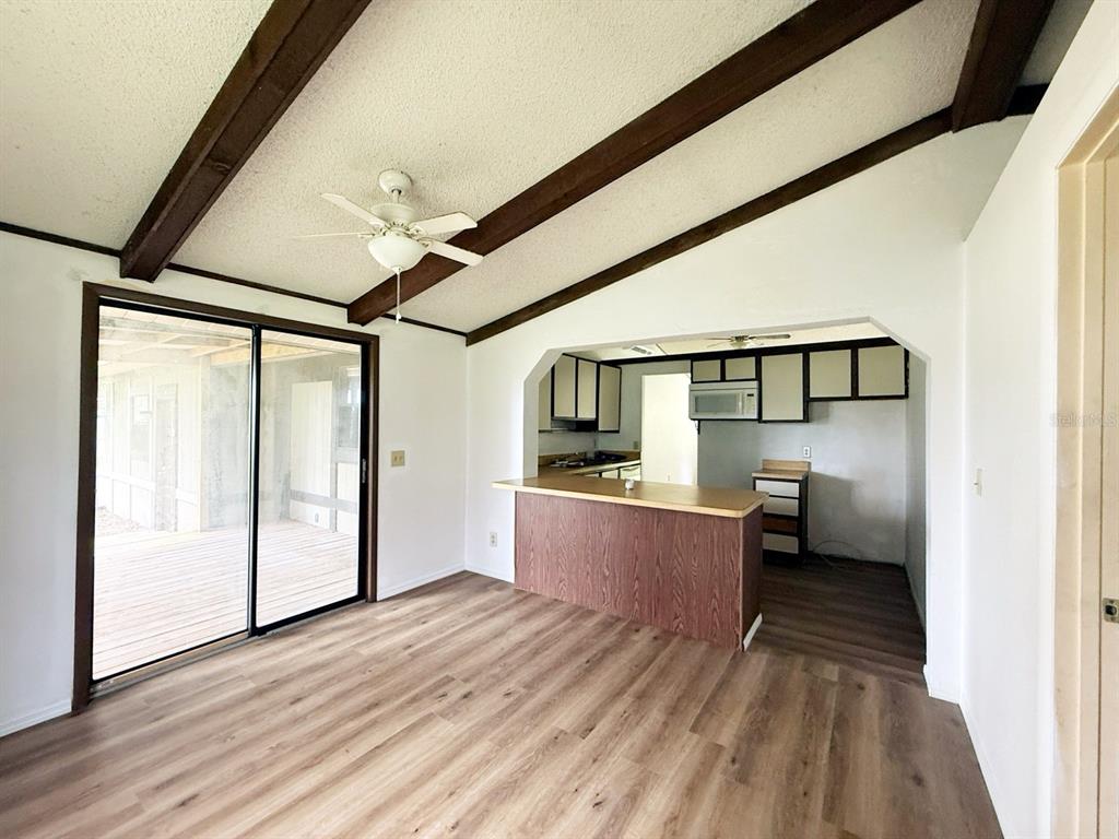 33248 Ridge Manor Boulevard Dade City, FL 33523 - Photo 17 of 20 a view of a living room with a large window