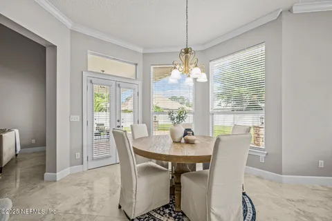a spacious bathroom with a tub sink and mirror