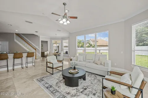 a bathroom with a granite countertop sink a toilet and shower