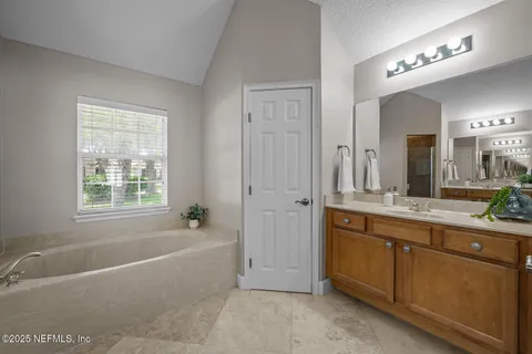 a view of room with window and ceiling fan
