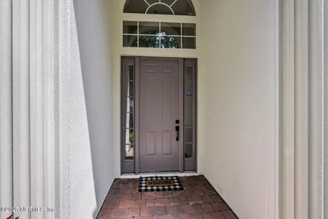 a view of a door and a window