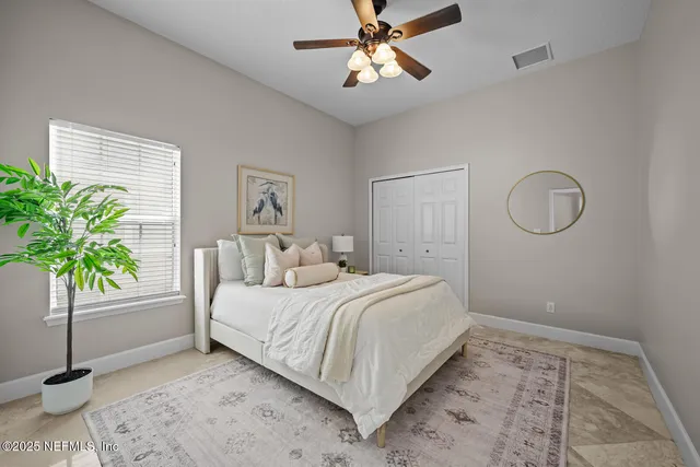 a bathroom with a granite countertop toilet sink and mirror