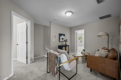 a view of a house with a backyard and a patio