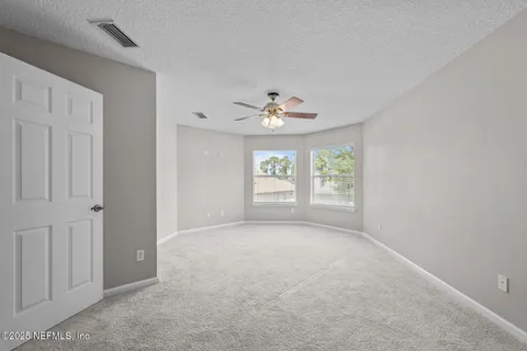 a view of a house with a big yard